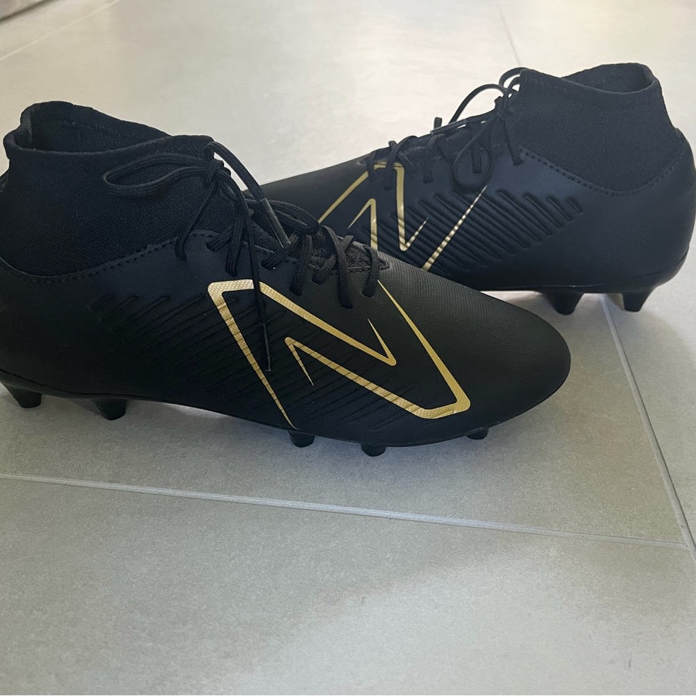 New Balance Tekela Black and Gold Soccer Cleats